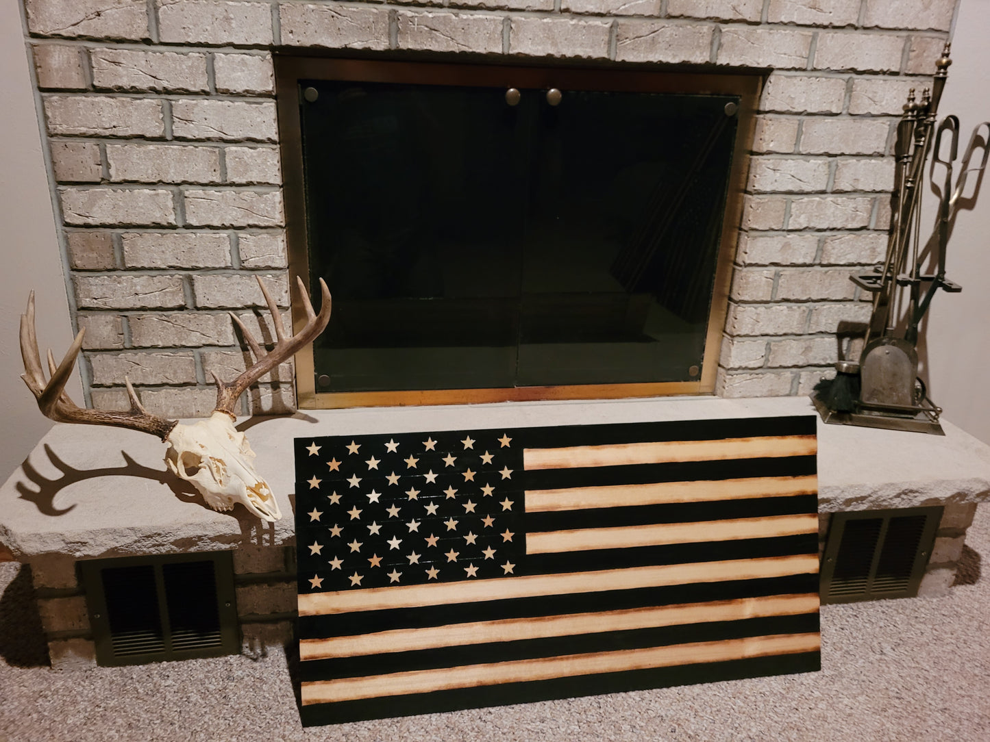 Black and tan wood flag